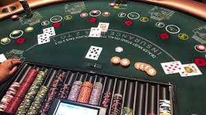 asustoto 2 platform interface showing live-dealer tables, slot games, and sportsbook markets on mobile phone